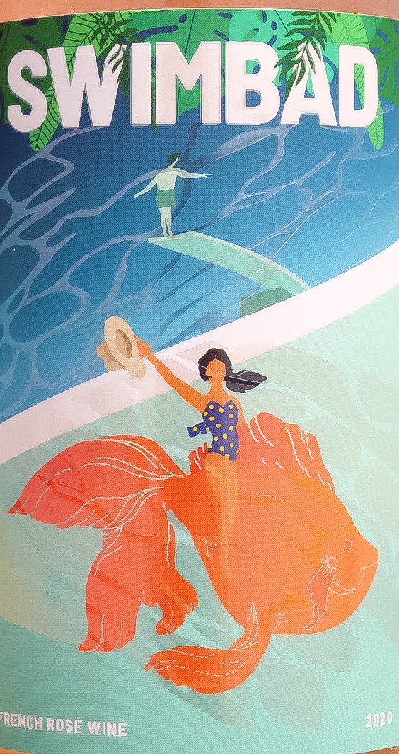 The Swimbad rosé label — a woman riding a giant goldfish across a pool while a man walks the diving board behind her